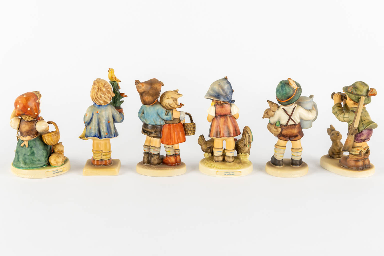 Hummel, 12 figurines, polychrome porcelain. (H:15 cm)