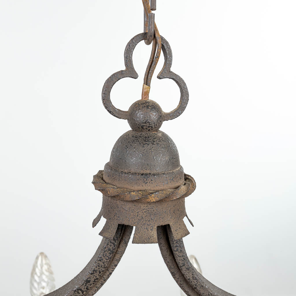 An antique chandelier with large wood beam and finished with wrought iron. (H:41cm)