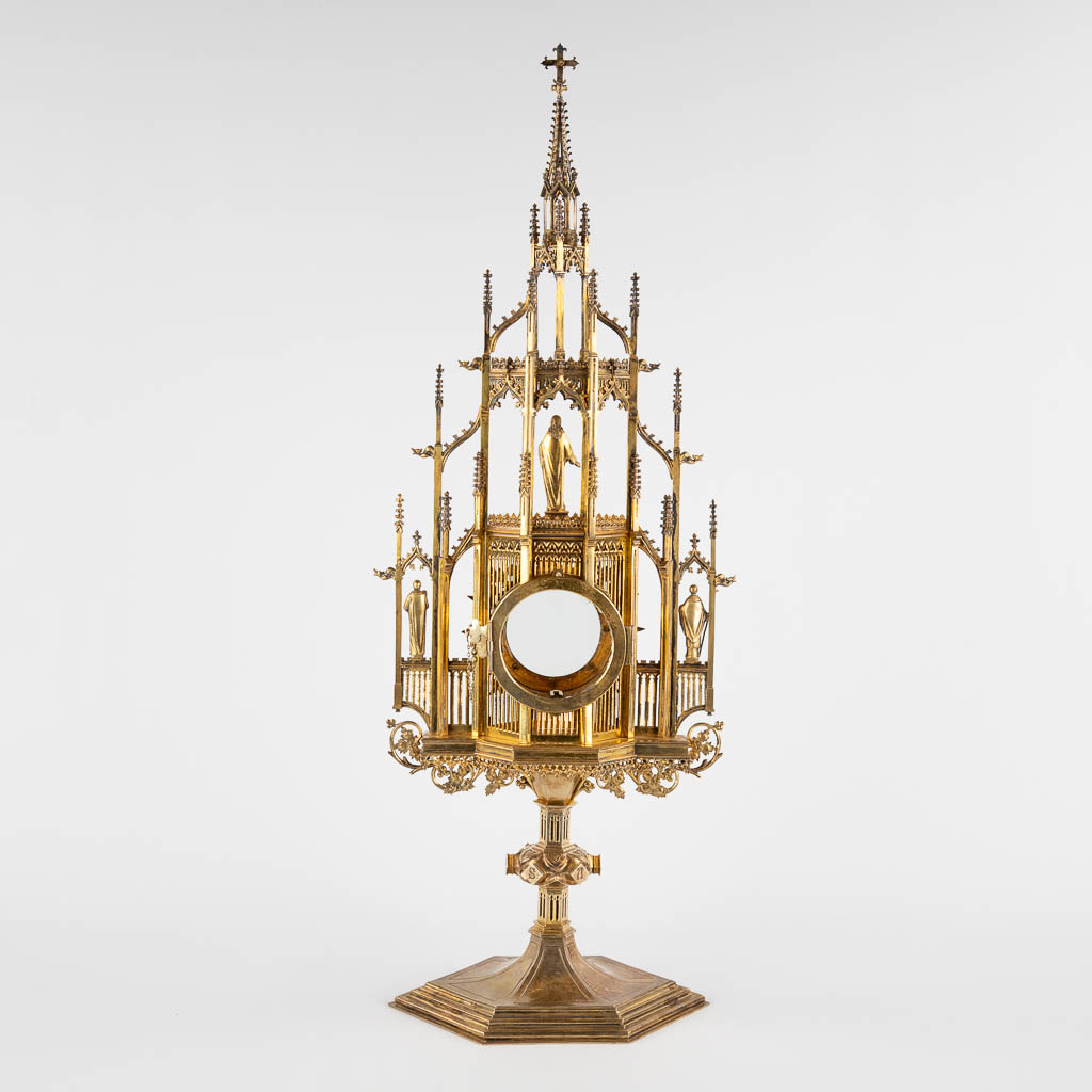 A large tower monstrance, gilt silver and brass in a Gothic Revival style. 19th C. (D:14 x W:26 x H:66 cm)