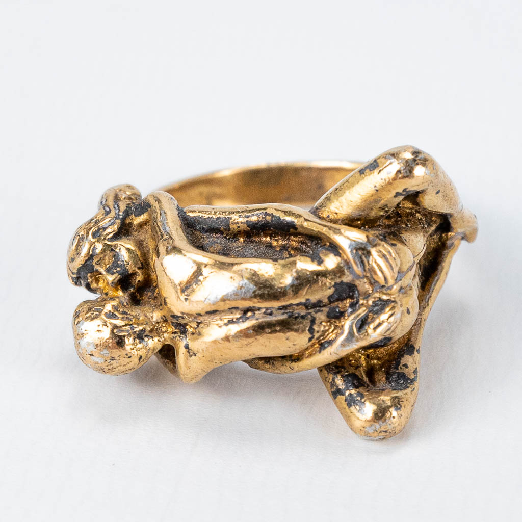 An antique gold-plated silver ring with erotic scene marked 925. 