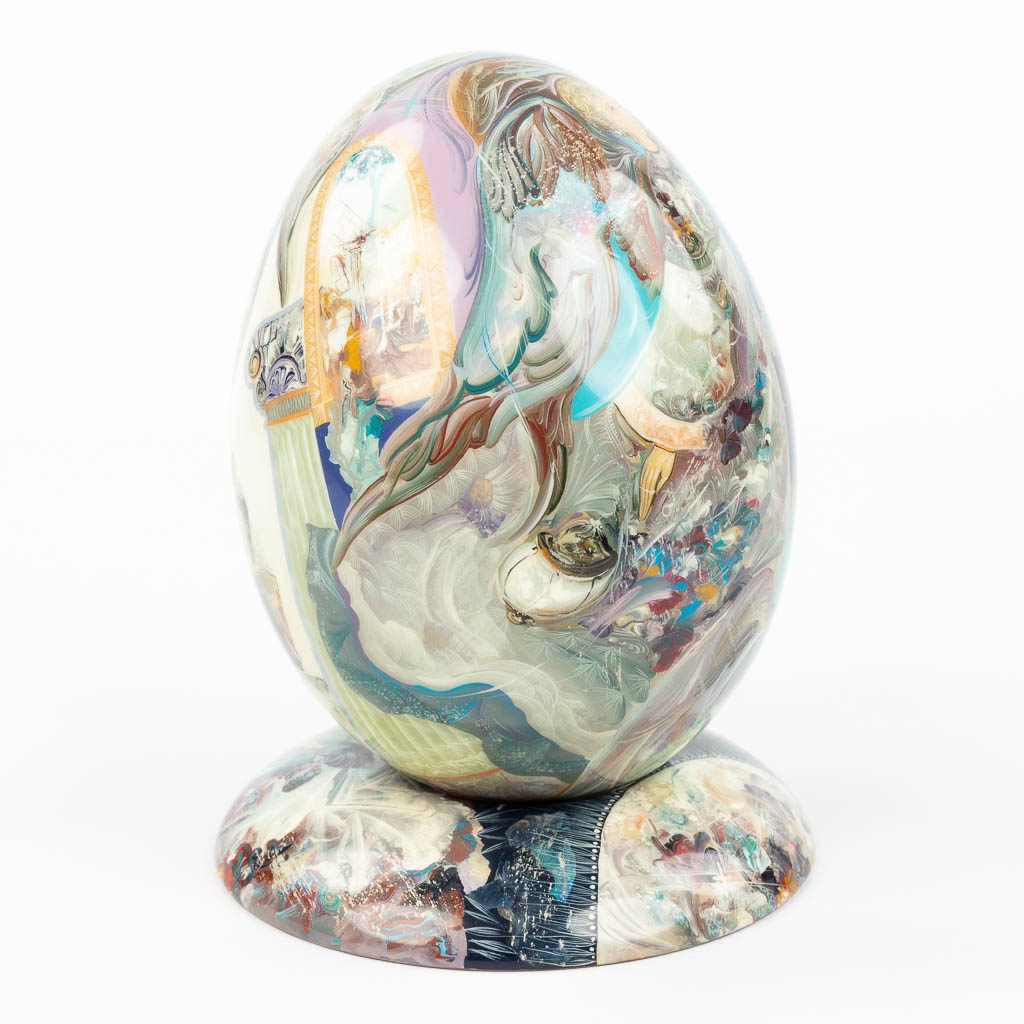 A hand-painted egg on a stand and made of Wood. Marked Stiva Goriachij, made in Russia. (H:17cm)