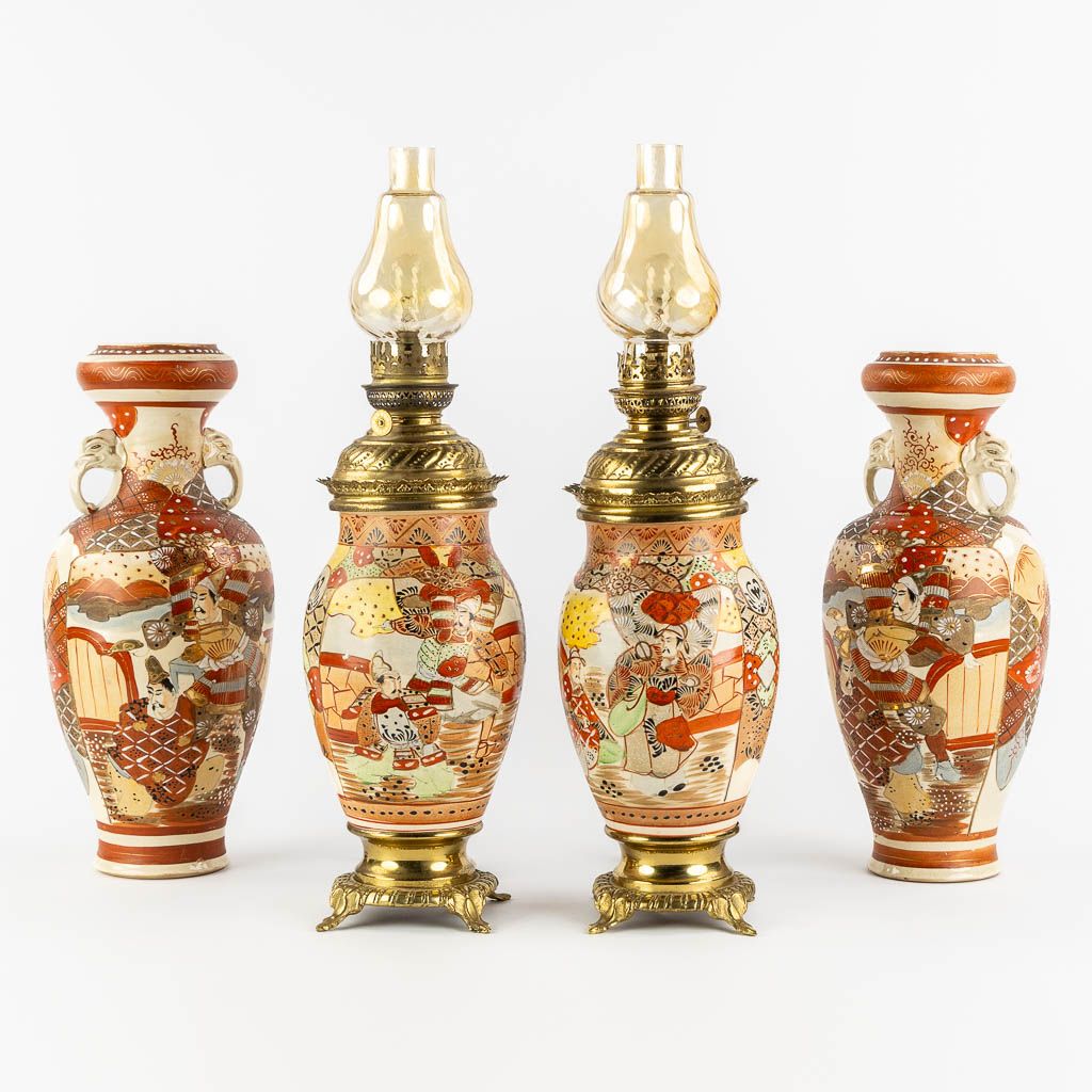 Lot 034 Two Japanese Kutani oil lamps, added two vases. (H:57 x D:15 cm)