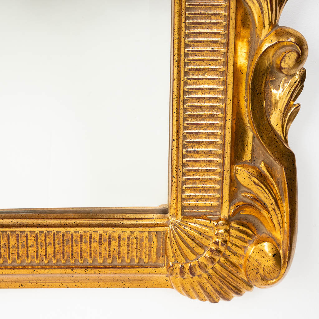 Deknudt, een vergulde spiegel, 20ste eeuw. (W:76 x H:124 cm)