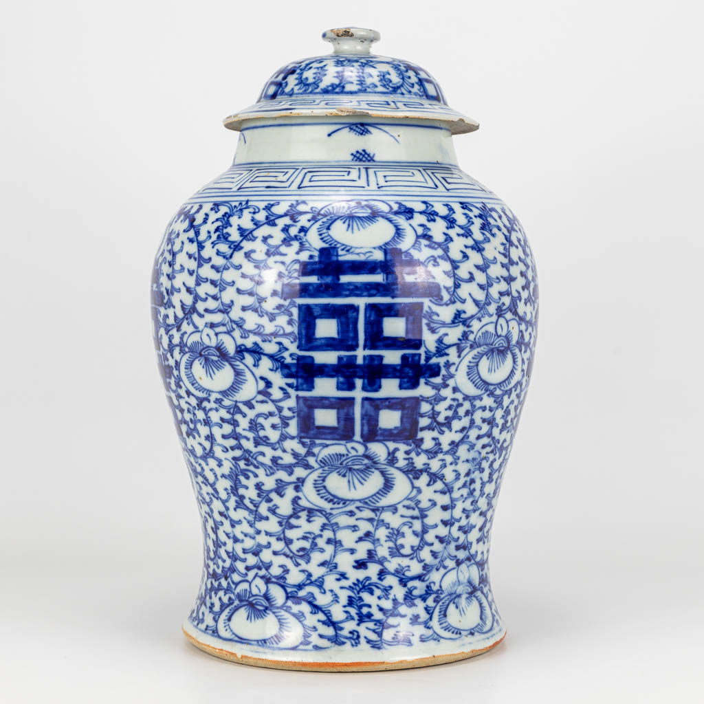 A vase with a cover made of Chinese porcelain and decorated with a blue-white decor double Xi symbols of happiness. (H:41cm)