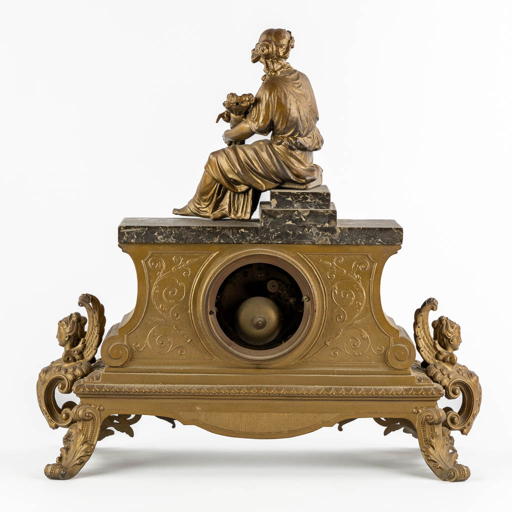 J. Dusart Bruxelles, A mantle clock. Gilt spelter and marble. Circa 1900. (L:20 x W:47 x H:46 cm)