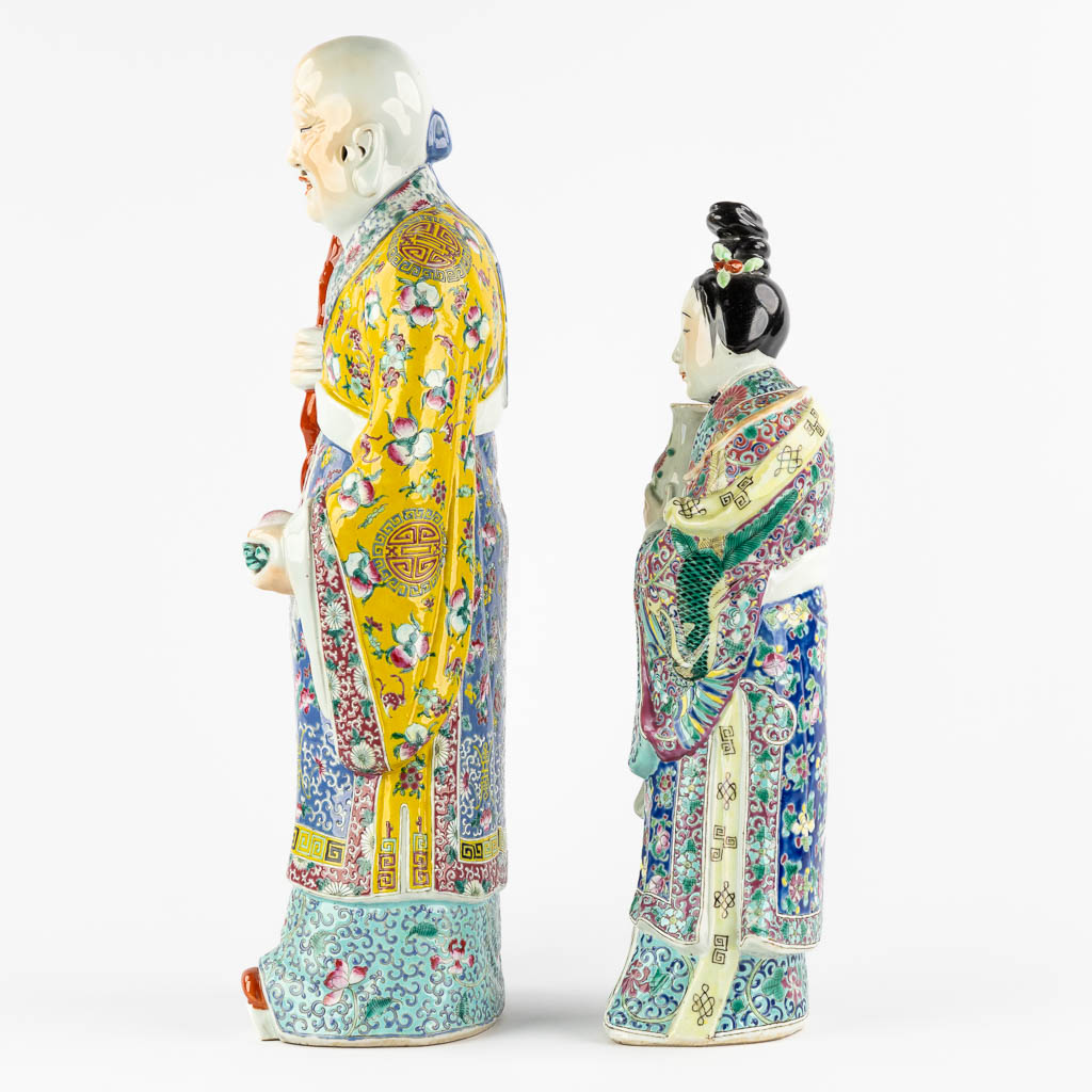 Two Chinese figurines 'Wise man with a peach' and a 'Lady'. 19th/20th C. (L:13 x W:22 x H:56 cm)