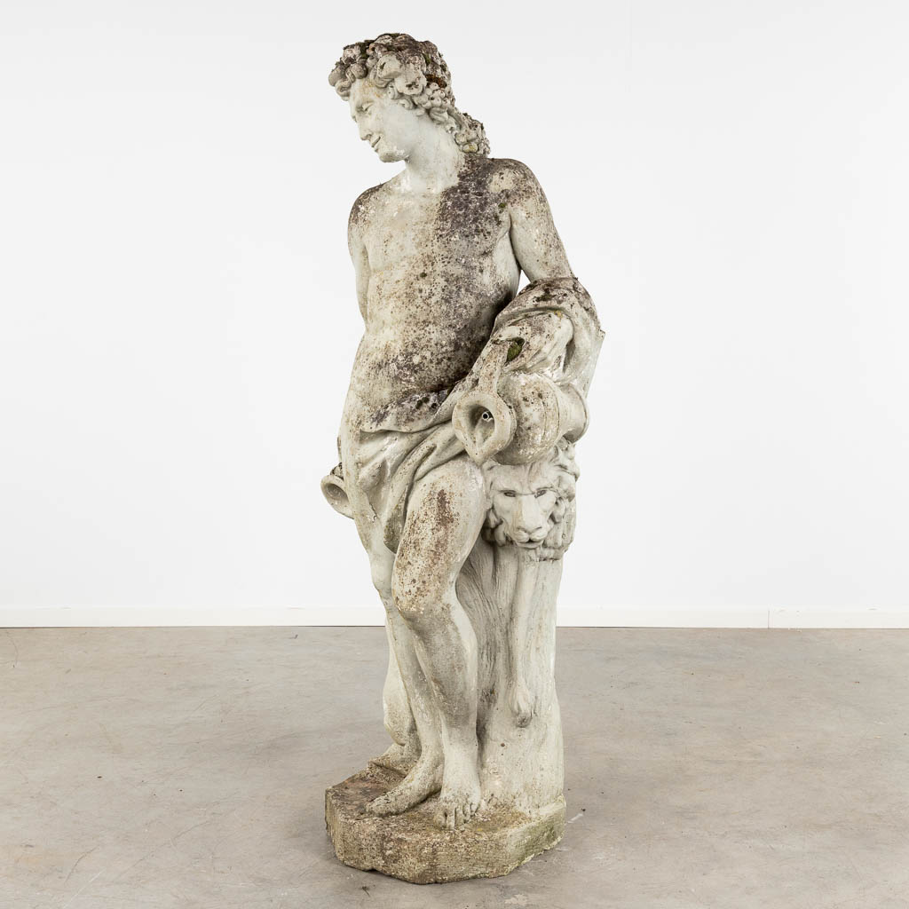 A large garden figurine of Bacchus, concrete, 20th C. (D:56 x W:74 x H:183 cm)
