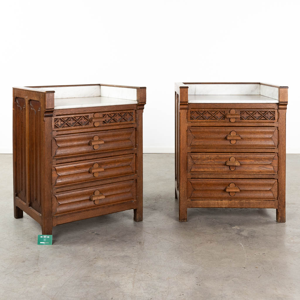 A pair of wood-sculptured cabinets in a gothic revival style. 19th C. (D:59 x W:70 x H:89 cm)