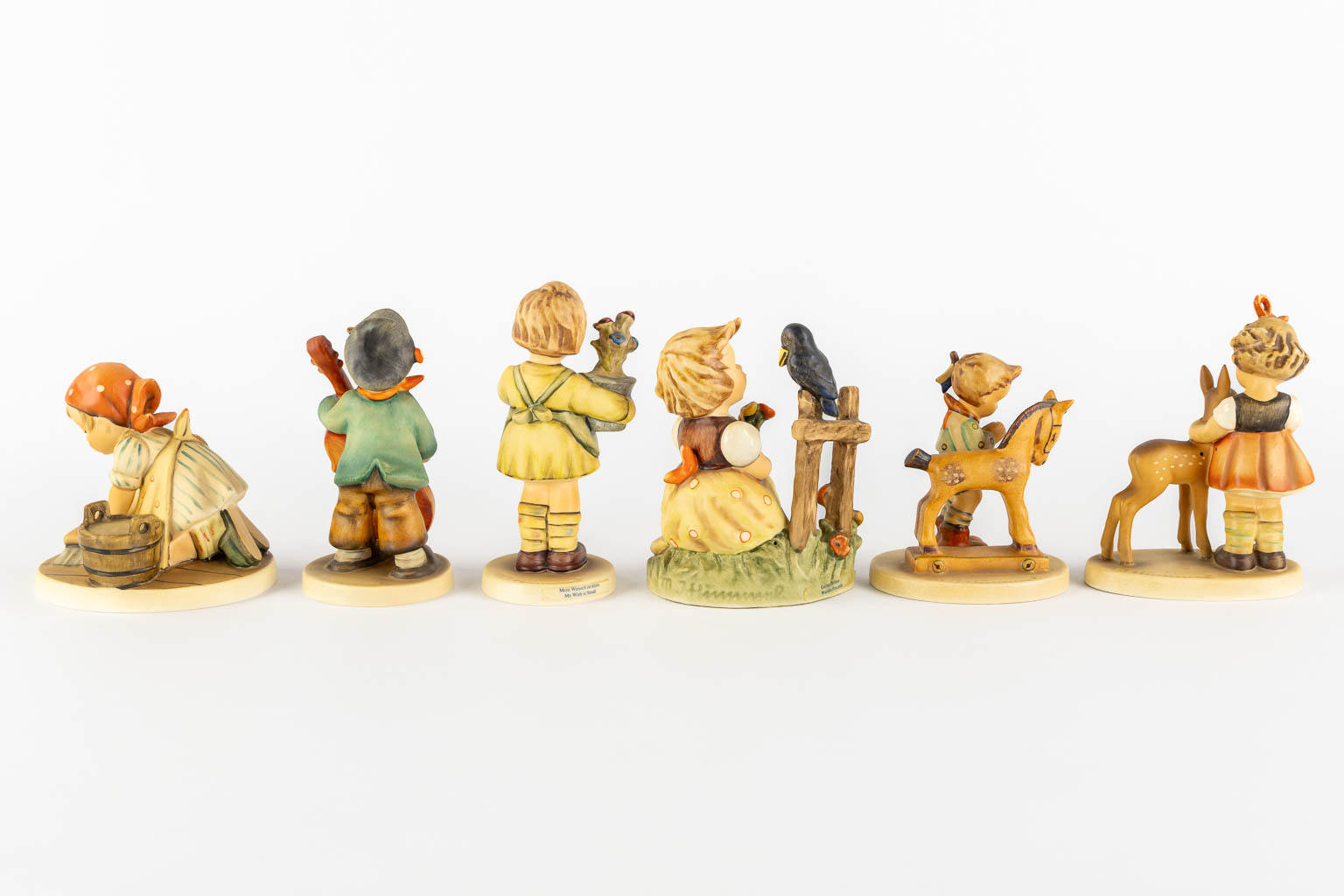 Hummel, 12 figurines, polychrome porcelain. (H:21 cm)