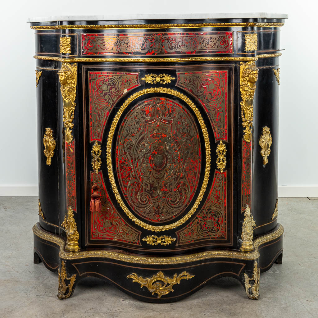 A cabinet with marble top made in Napoleon 3 style, mounted with bronze and finished with boulle tortoiseshell. (H:110cm)