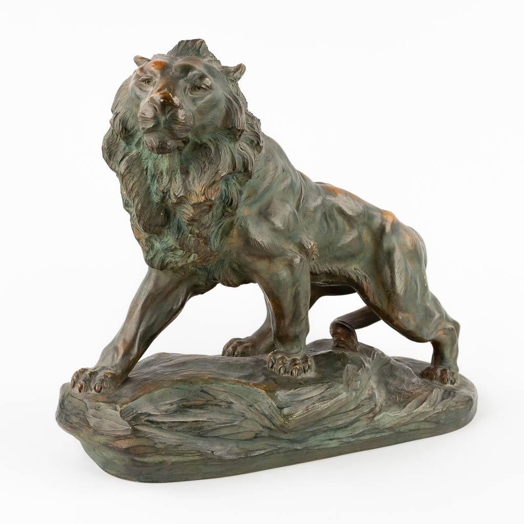 Armand FAGOTTO (XIX-XX) 'Lion' patinated terracotta. (D:20 x W:47 x H:39 cm)