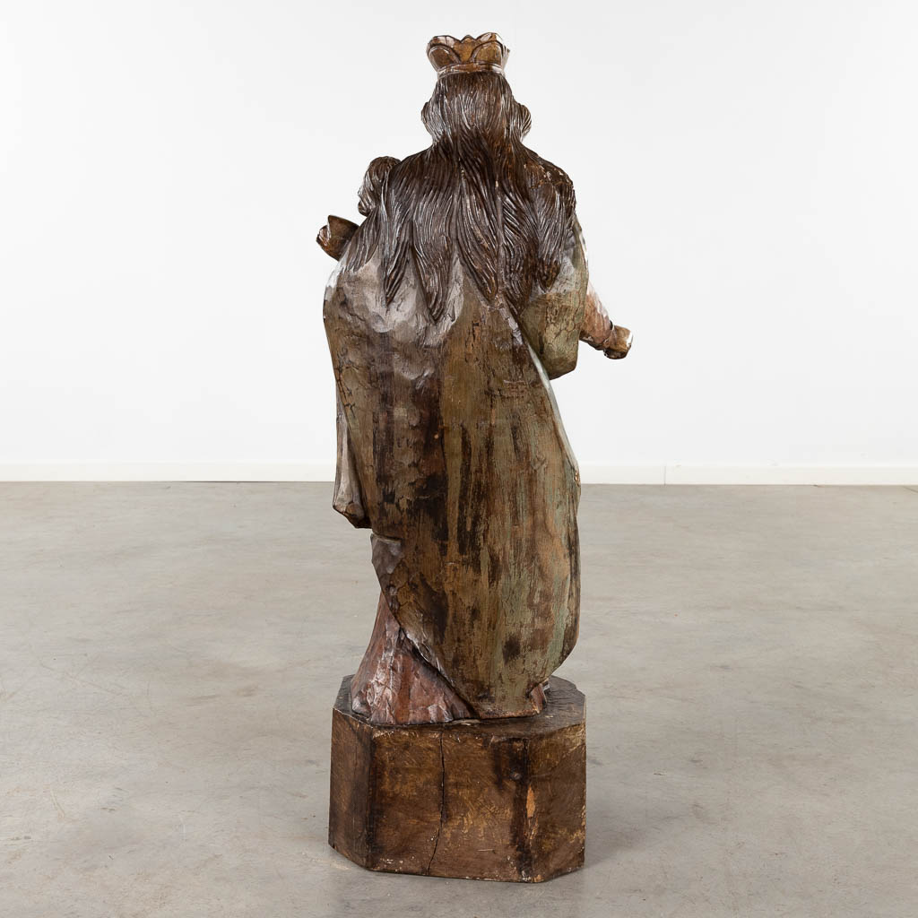 A large wood-sculptured figurine of Madonna. (D:28 x W:29 x H:95 cm)