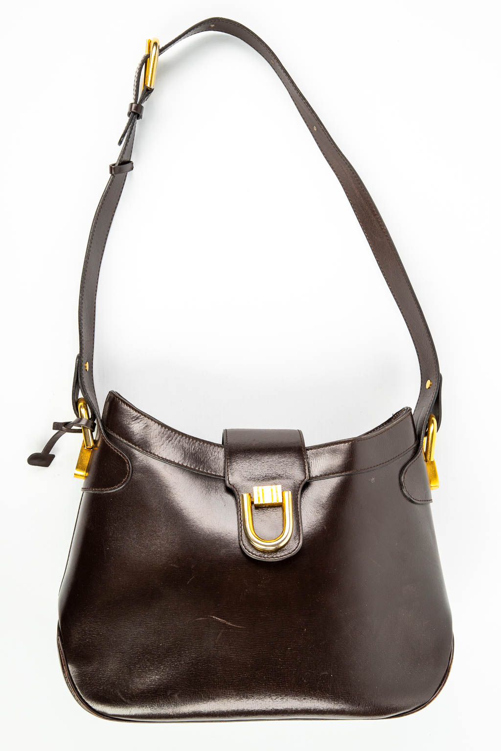 Een handtas gemaakt uit bruin leder en gemerkt Delvaux. Gemonteerd met vergulde elementen. (H:23cm)