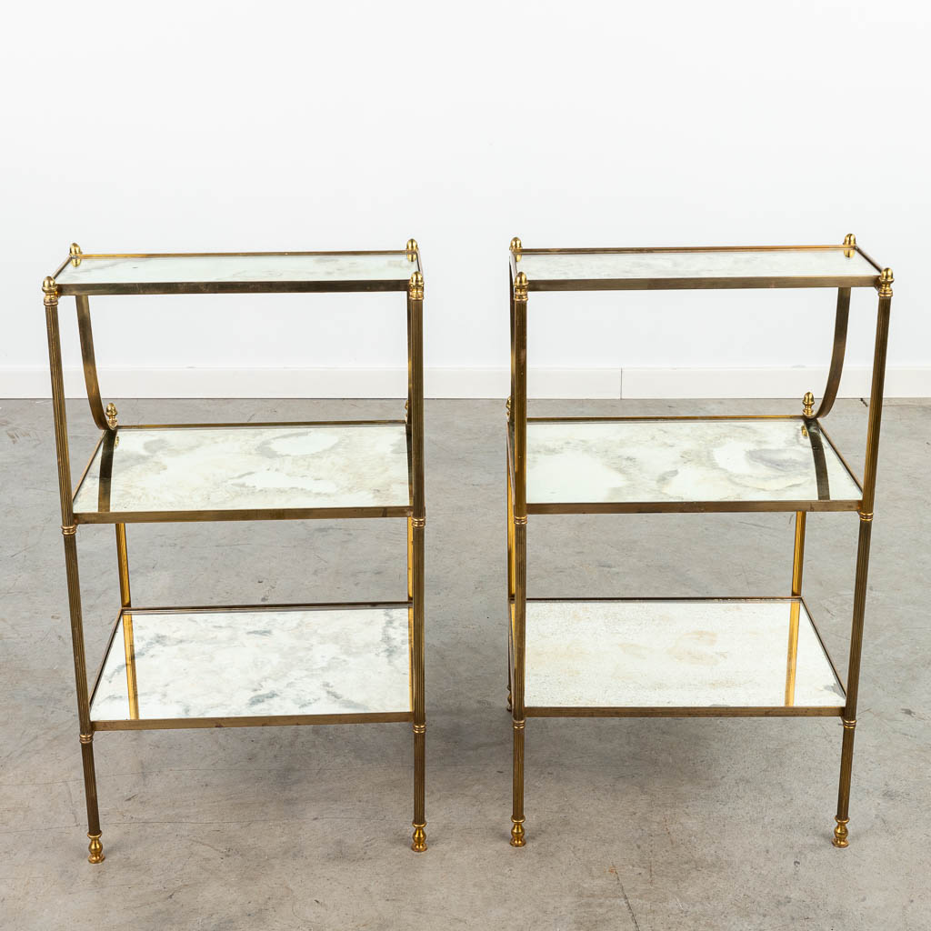 A pair of three tiers side tables made of brass and glass by Maison Jansen. (H:71cm)