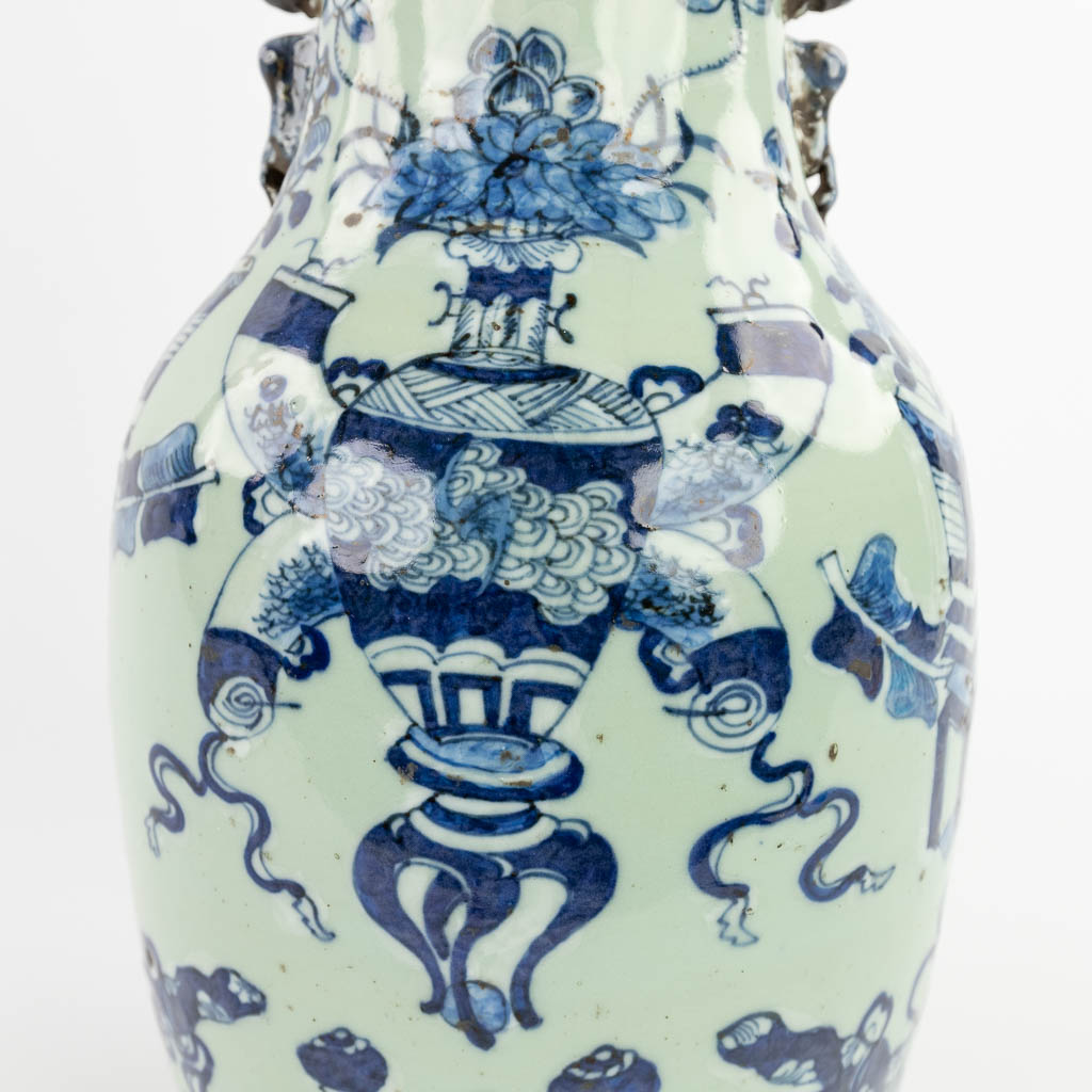 Two Chinese vases, celadon with a blue-white decor. 19th/20th C. (H:59 x D:24 cm)