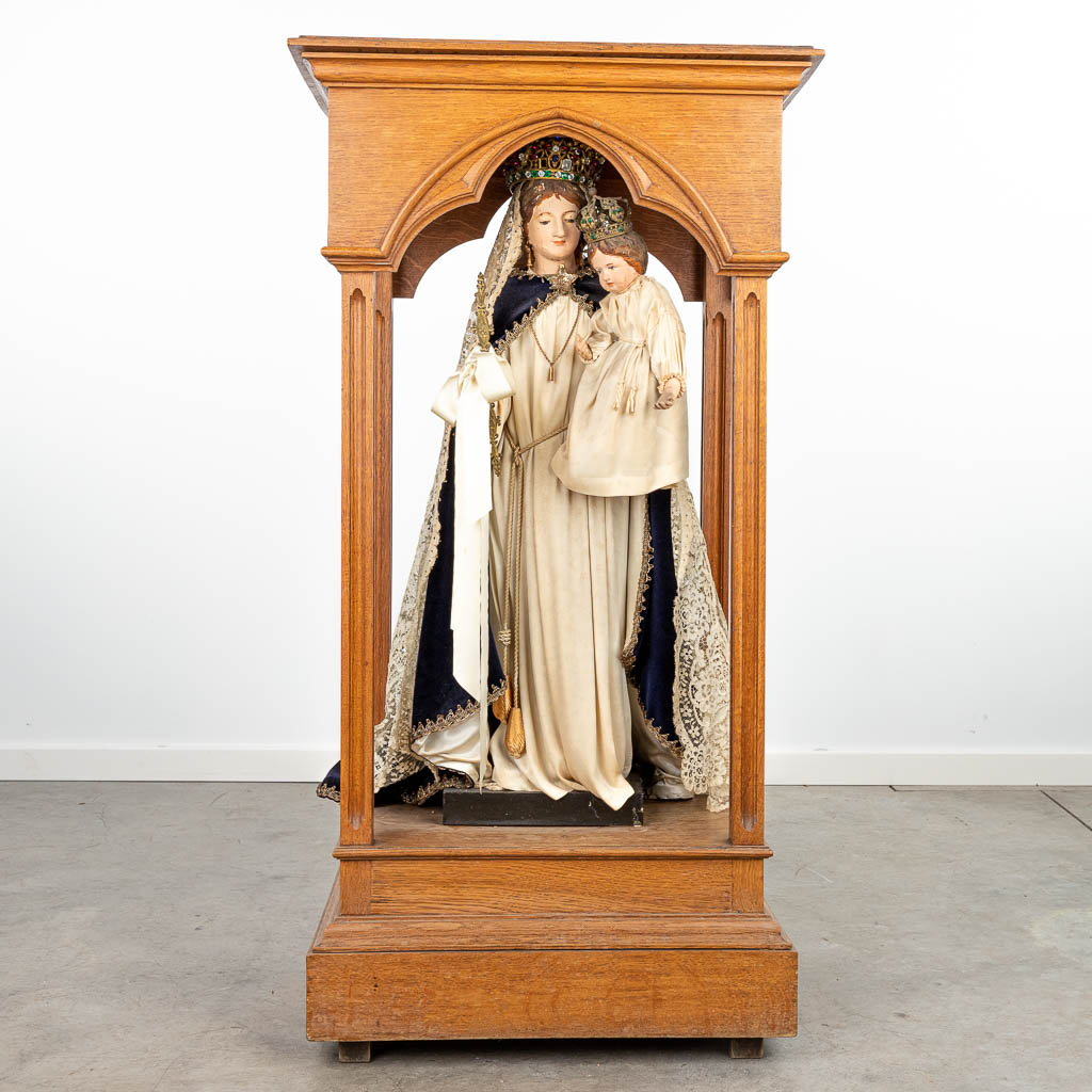 A statue of 'Our Lady' Madonna with child in a shrine, made of polychrome wood. (H:114cm)