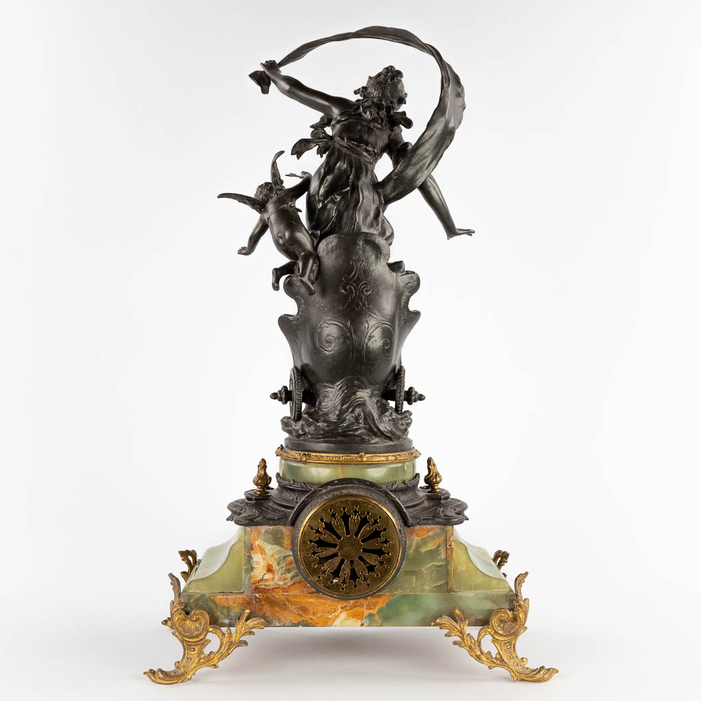 Auguste MOREAU (1834-1917) A mantle clock, spelter on green onyx, 19th C. (D:21 x W:44 x H:63 cm)