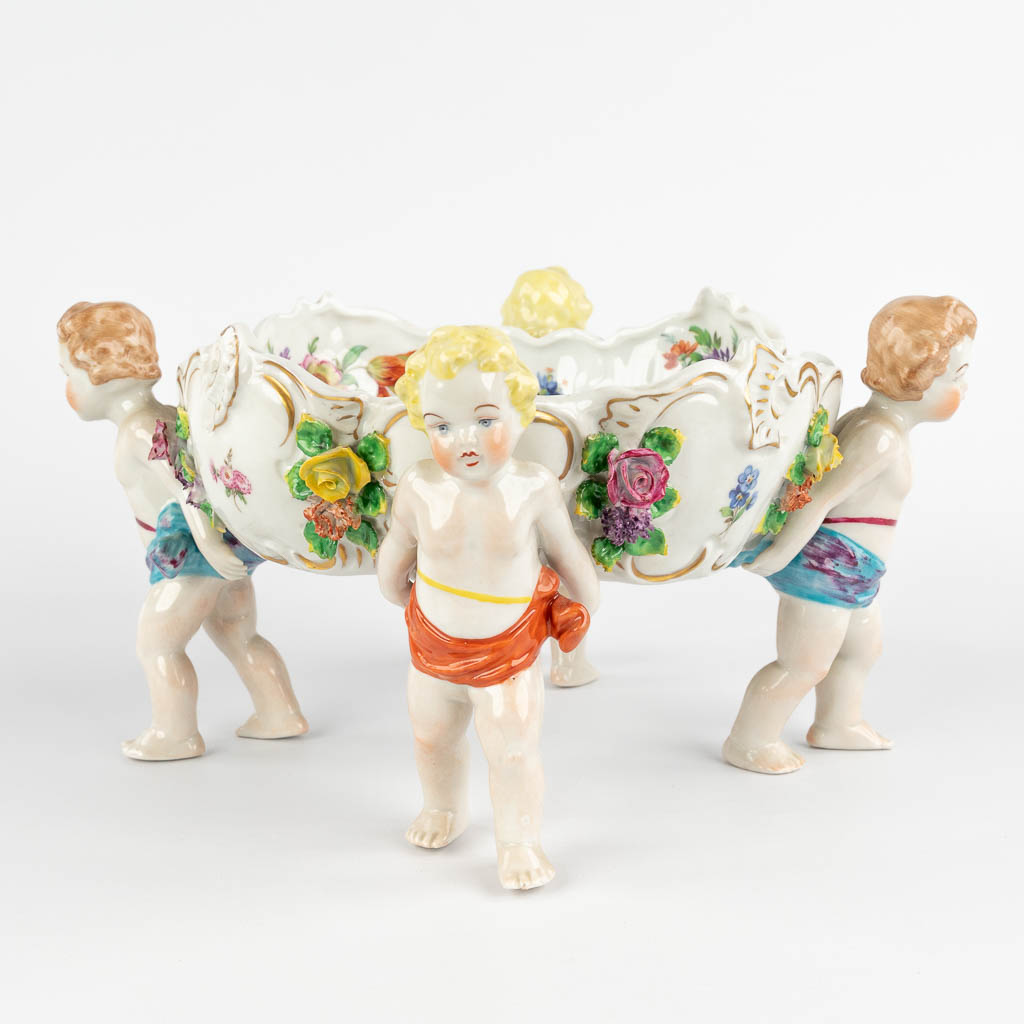 Capodimonte, a bowl carried by children. 20th C. (H:16 x D:31 cm)