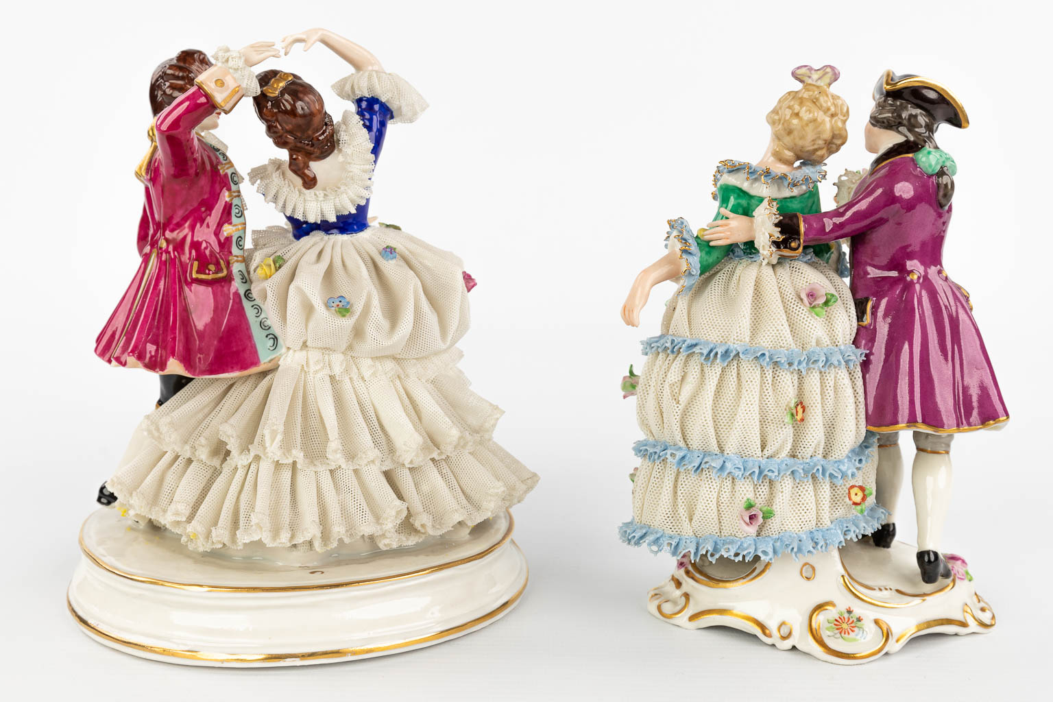 A pair of porcelain figurines with a lace dress. Made in Germany and marked Dresden. (H:19cm)