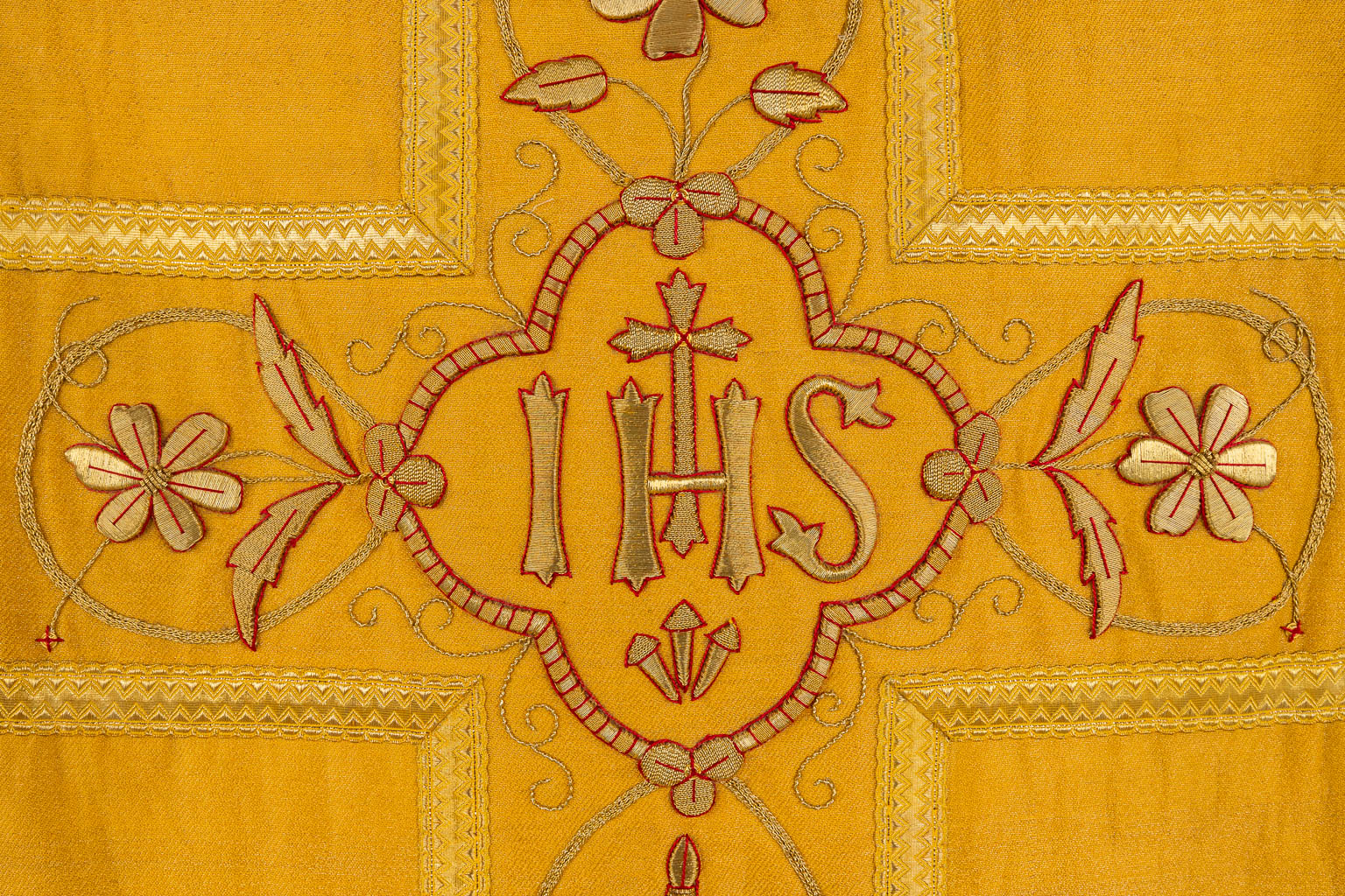 A cope, two humeral veils, a Roman Chasuble, finished with thick gold thread embroideries.
