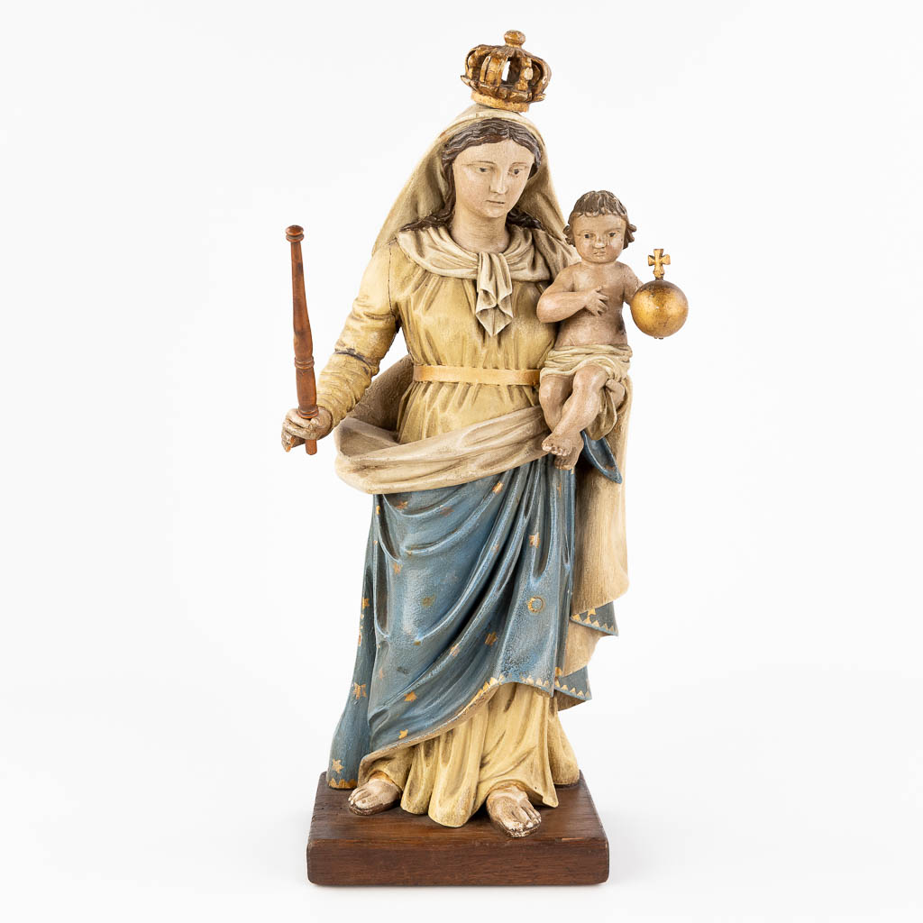  An antique wood-sculptured and polychrome statue of Madonna with child. Circa 1900-1920. 