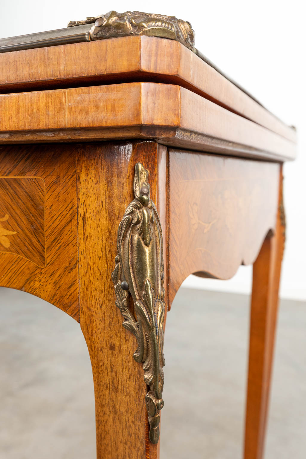 A game table finished with marquetry inlay in Louis XV style. (H:77cm)