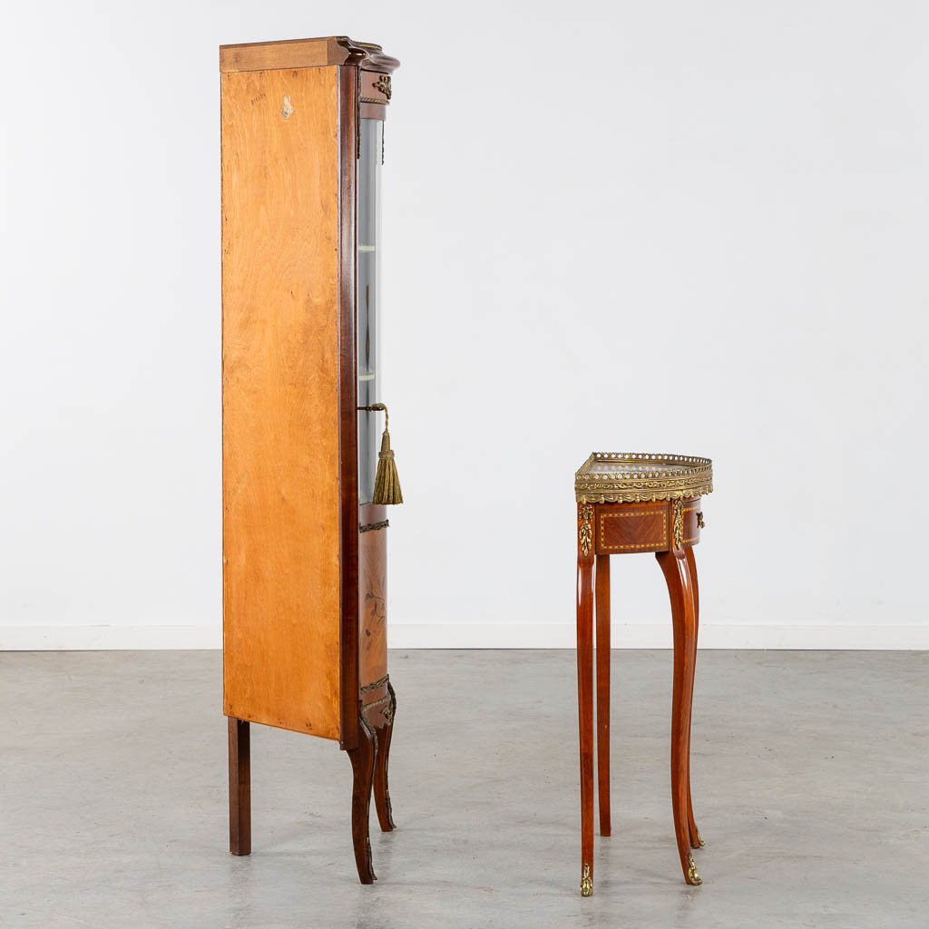 A corner cabinet and console table, marquetry mounted with bronze. 20th C. (L:34 x W:54 x H:150 cm)