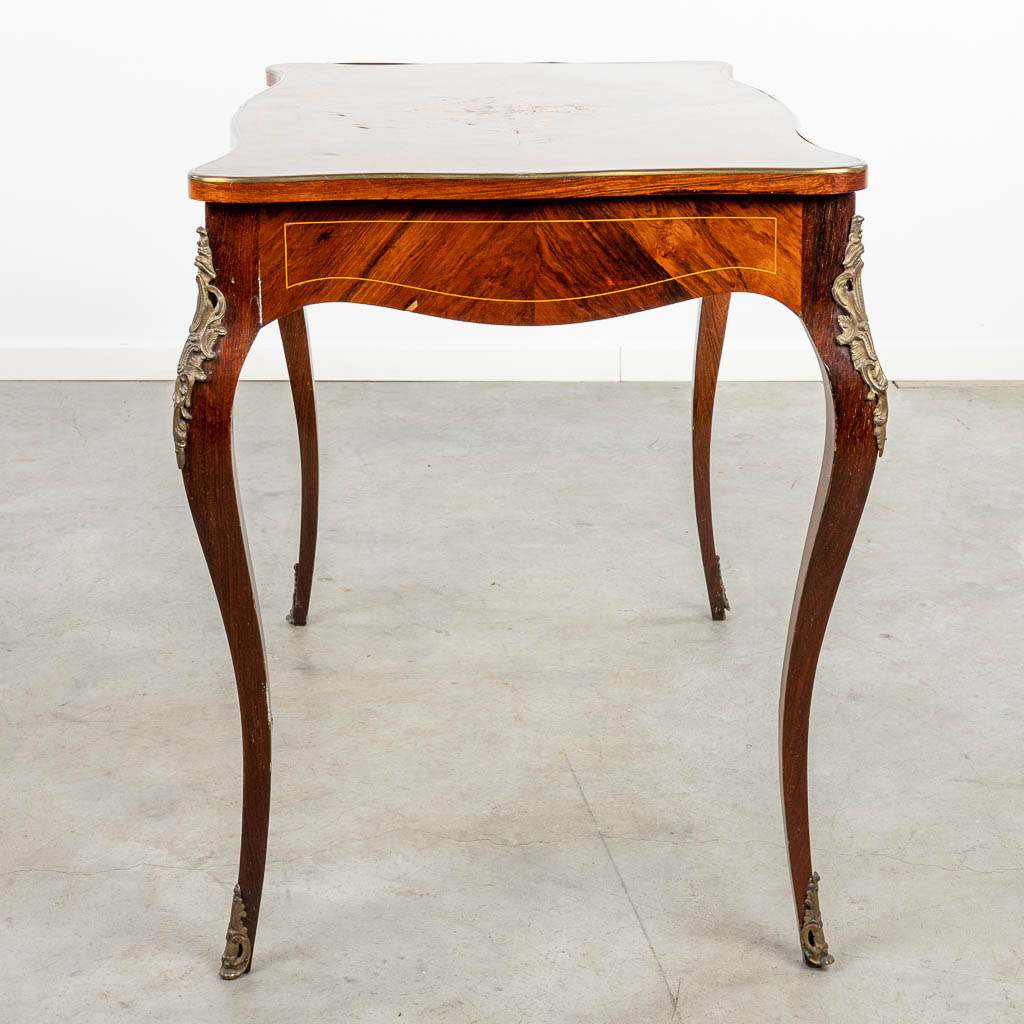A side table decorated with marquetry inlay in Louis XV style and finished with bronze. (H:76cm)