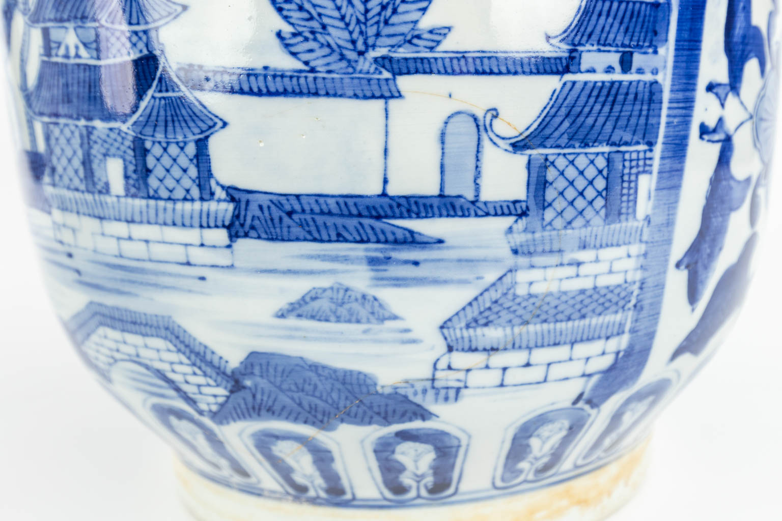 A set of 2 Chinese cache-pots made of porcelain of which 1 has a blue-white decor and the other a decor of peacocks. (H:35cm)