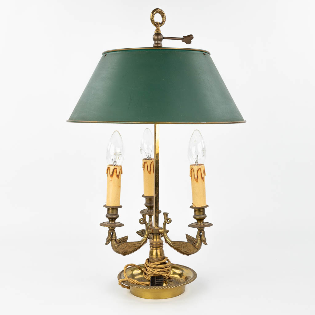 A table lamp made of bronze and decorated with swans in Empire style. (H:56cm)