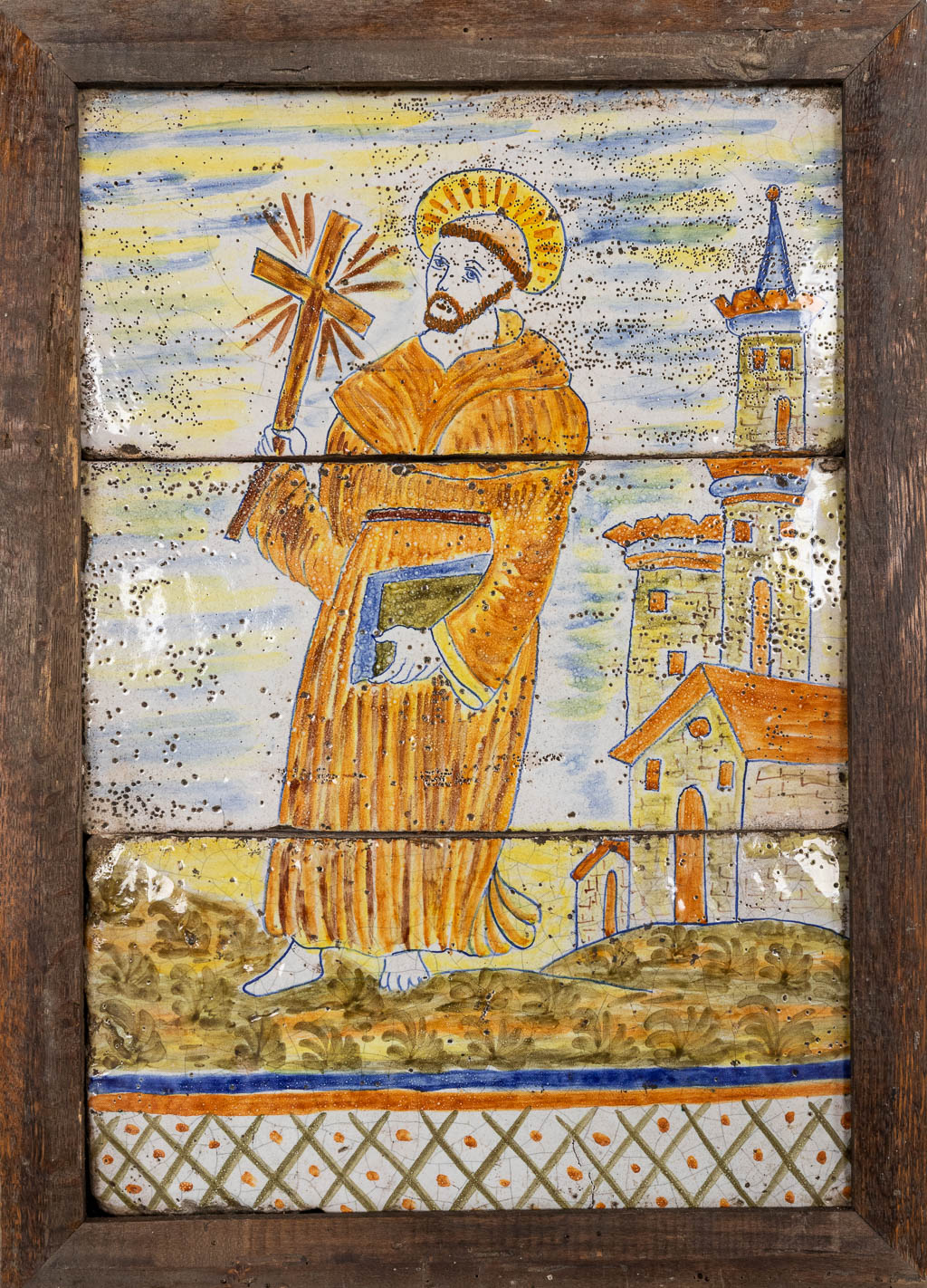 A glazed terracotta plaque of Saint Francis of Assisi with a crucifix. 18th/19th C. (W:40 x H:56 cm)