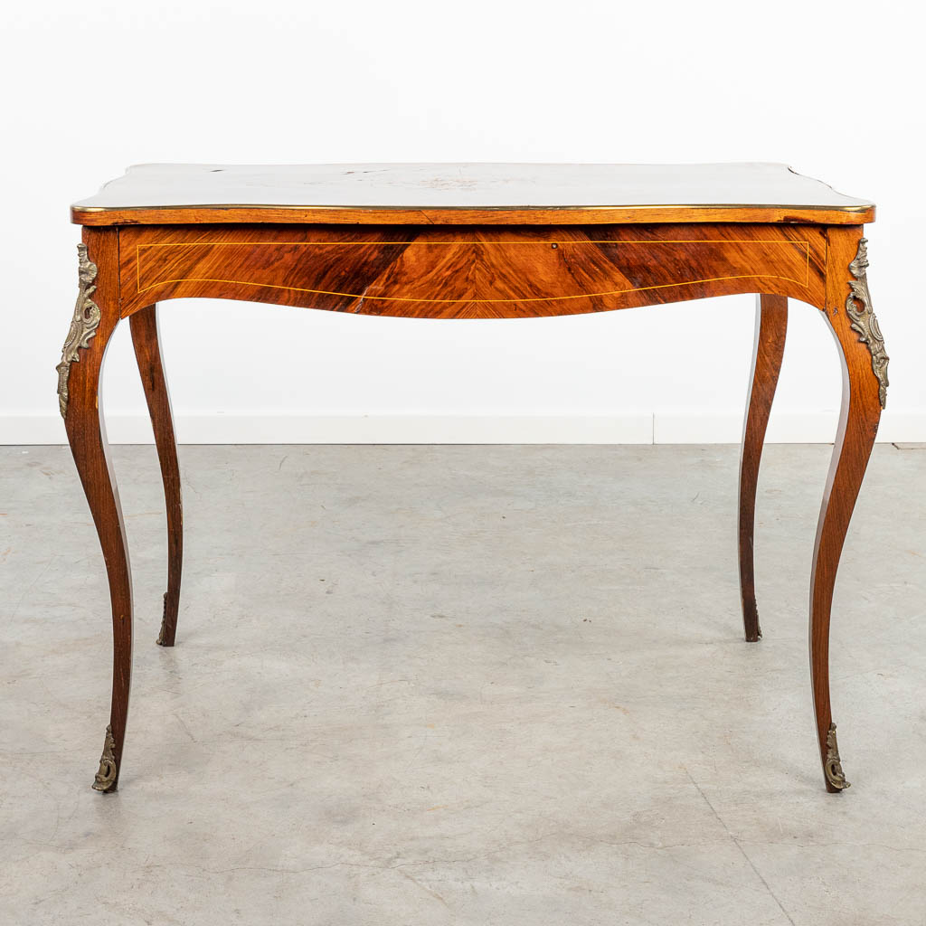 A side table decorated with marquetry inlay in Louis XV style and finished with bronze. (H:76cm)