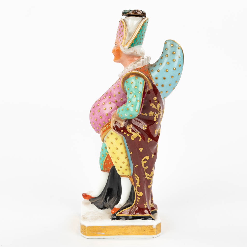 JACOB-PETIT (1796-1868) a perfume bottle in the shape of a harlequin, made of porcelain. (H:15,5cm)