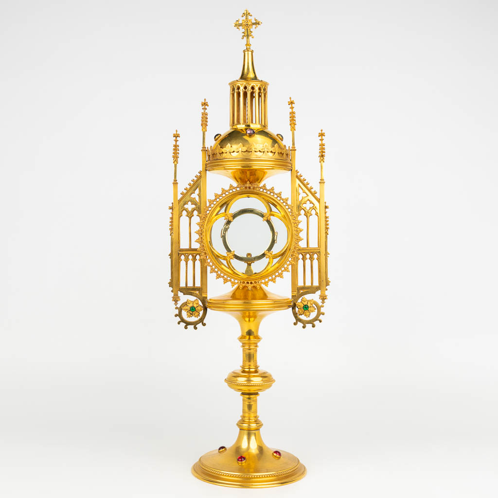 An antique tower monstrance, gothic revival and decorated with cabochons. (H:54,5cm)