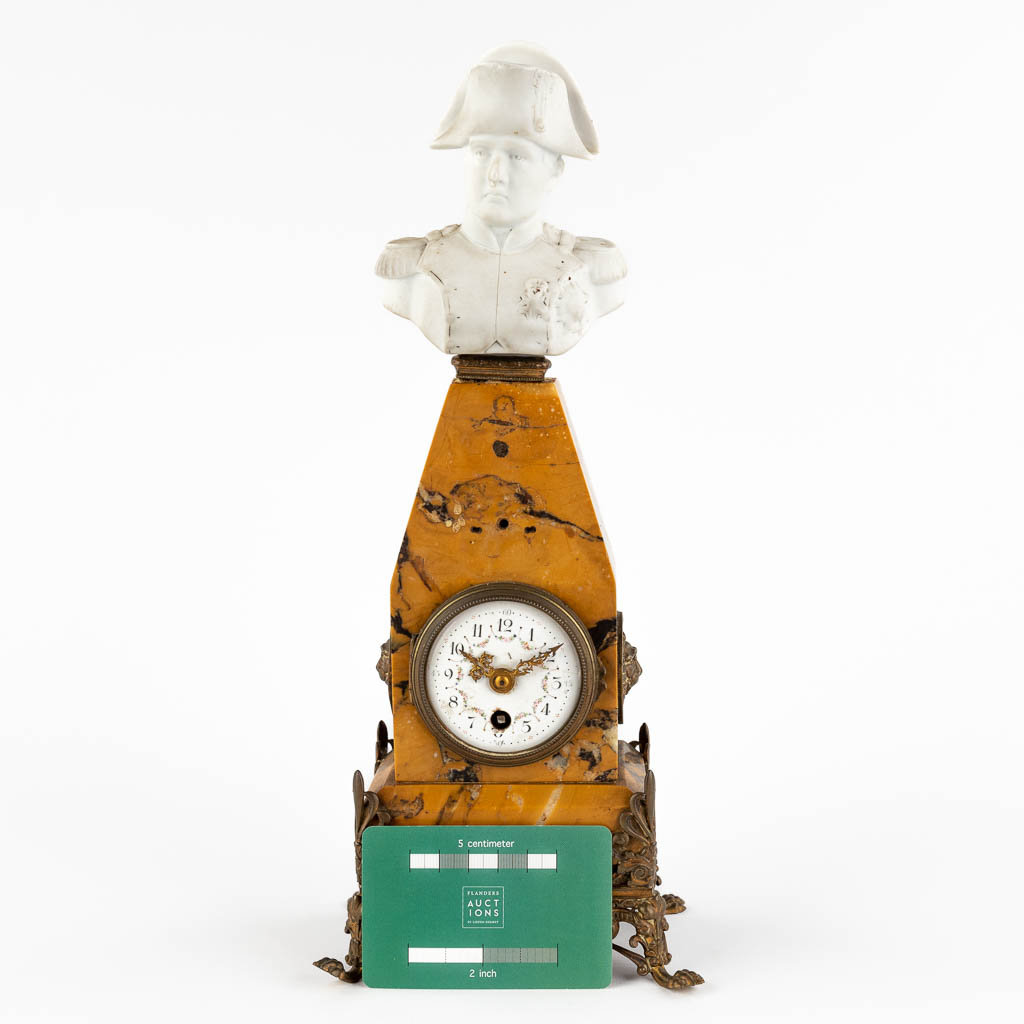 A mantle clock with an image of Napoleon Bonaparte, Marble and bisque porcelain. Circa 1880. (D:9 x W:13 x H:32 cm)