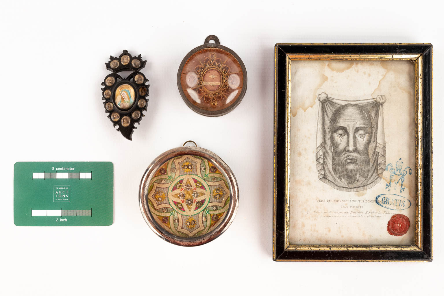 A small collection of relics and reliquary items, The Veil of Veronica, a relic in the shape of a sacred heart and more. (W:13 x