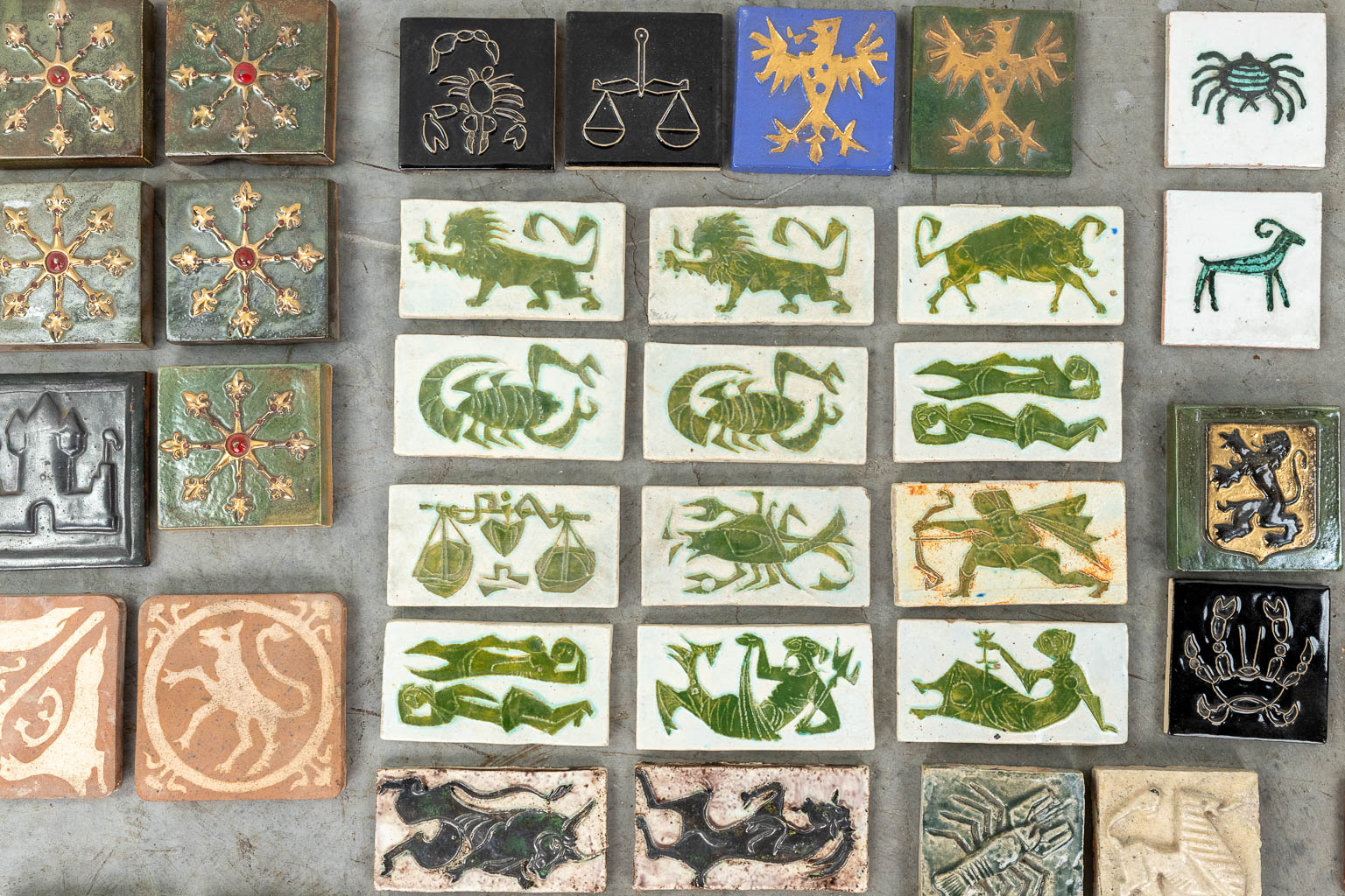 Roger GUERIN (1896-1954) a large collection of tiles with the zodiac, heraldic and animals. 