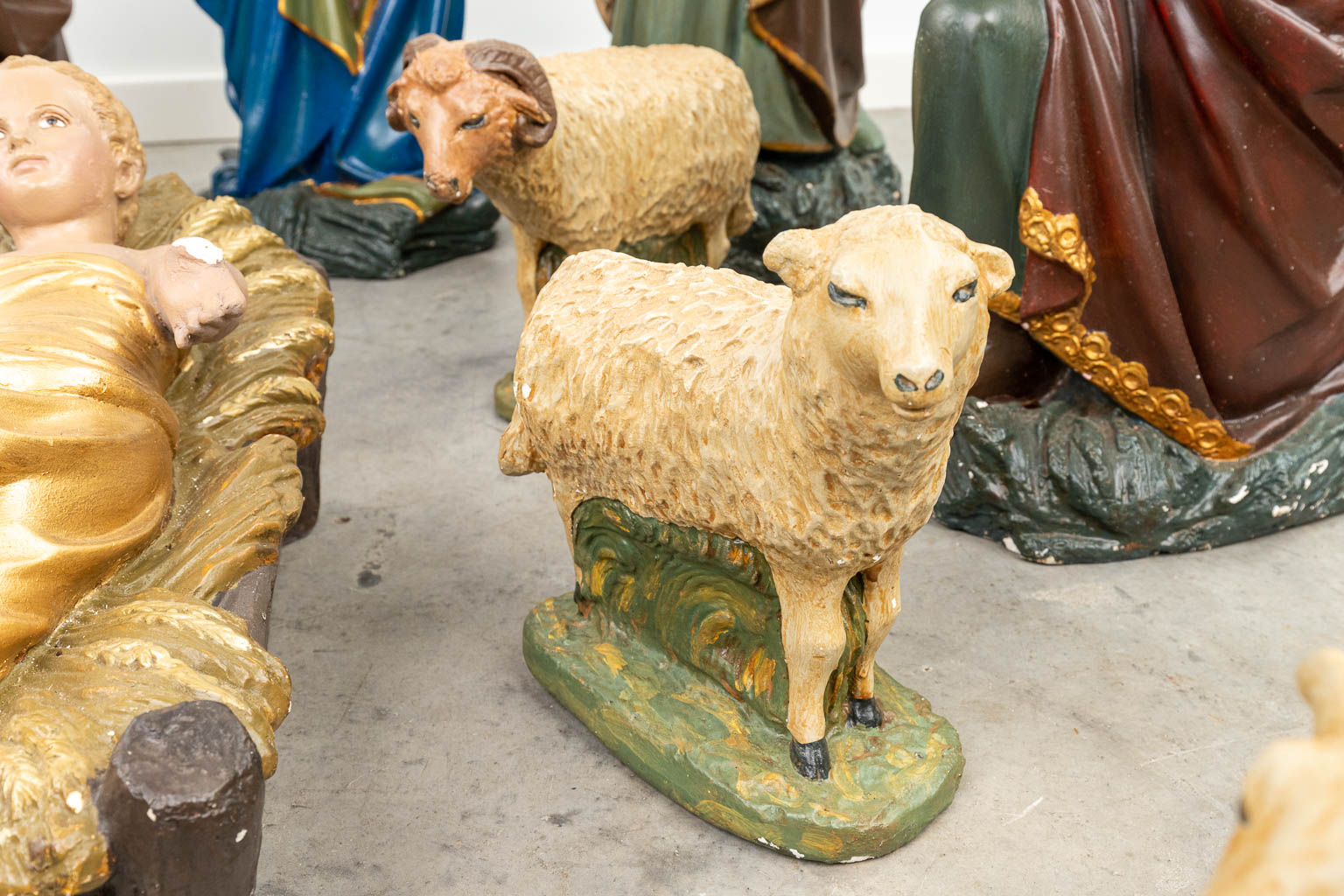 A complete and large figurative Nativity scene made of patinated plaster