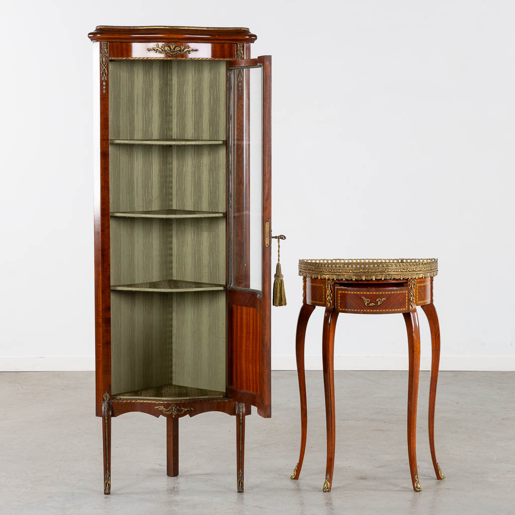 A corner cabinet and console table, marquetry mounted with bronze. 20th C. (L:34 x W:54 x H:150 cm)