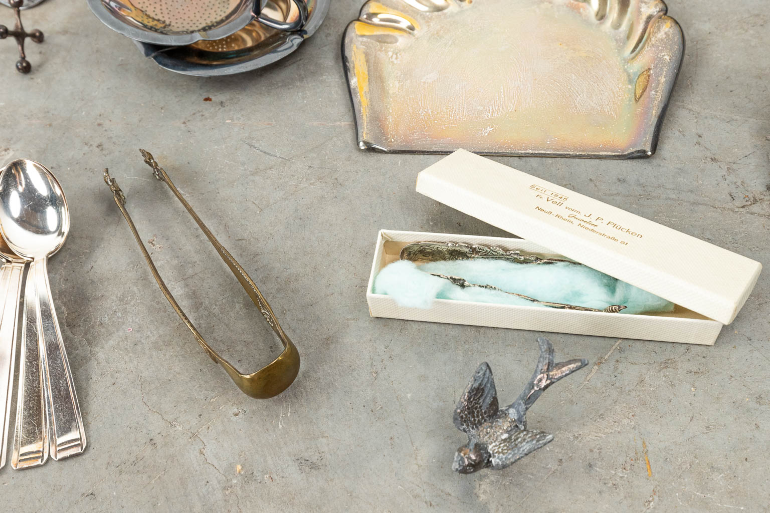 An assembled collection of silver-plated cutlery and accessories. 