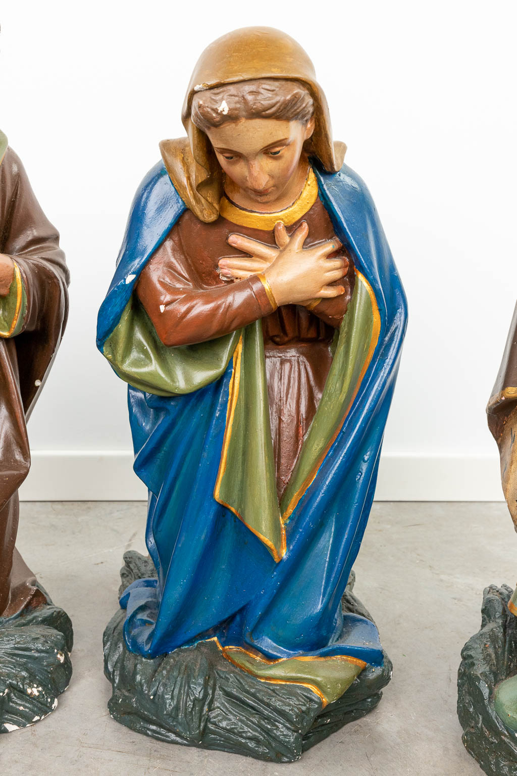 A complete and large figurative Nativity scene made of patinated plaster