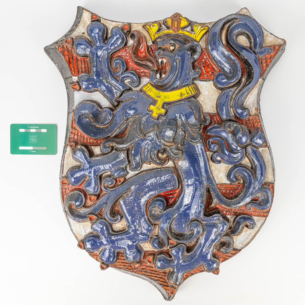 A large glazed terracotta coat of arms, 