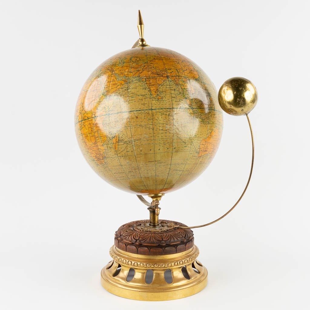 G. Thomas, a globe with a moon, mounted on a brass base. (W:43 x H:59 x D:30 cm)