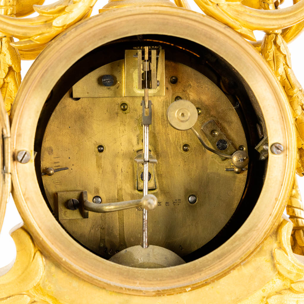 Lerolle Paris, a three-piece mantle garniture clock and candelabra, gilt bronze. France, 19th C. (L:26 x W:70 x H:65 cm)