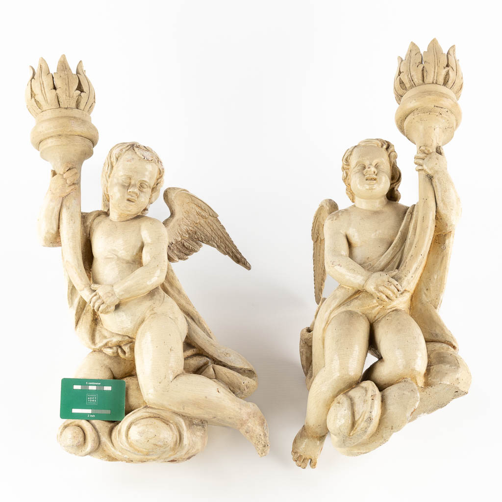 Two antique angels with candle holders, wood sculptured with white patina. 18th C. (W:32 x H:59 cm)