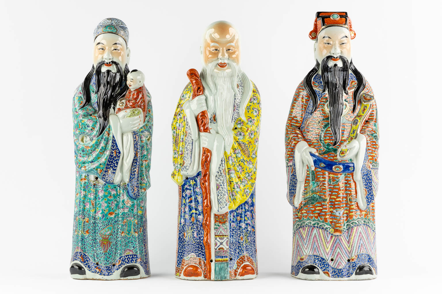 Three Chinese Famille Rose porcelain figurines of Fu, Lu and Shou. 20th C. (L:15 x W:20 x H:62,5 cm)