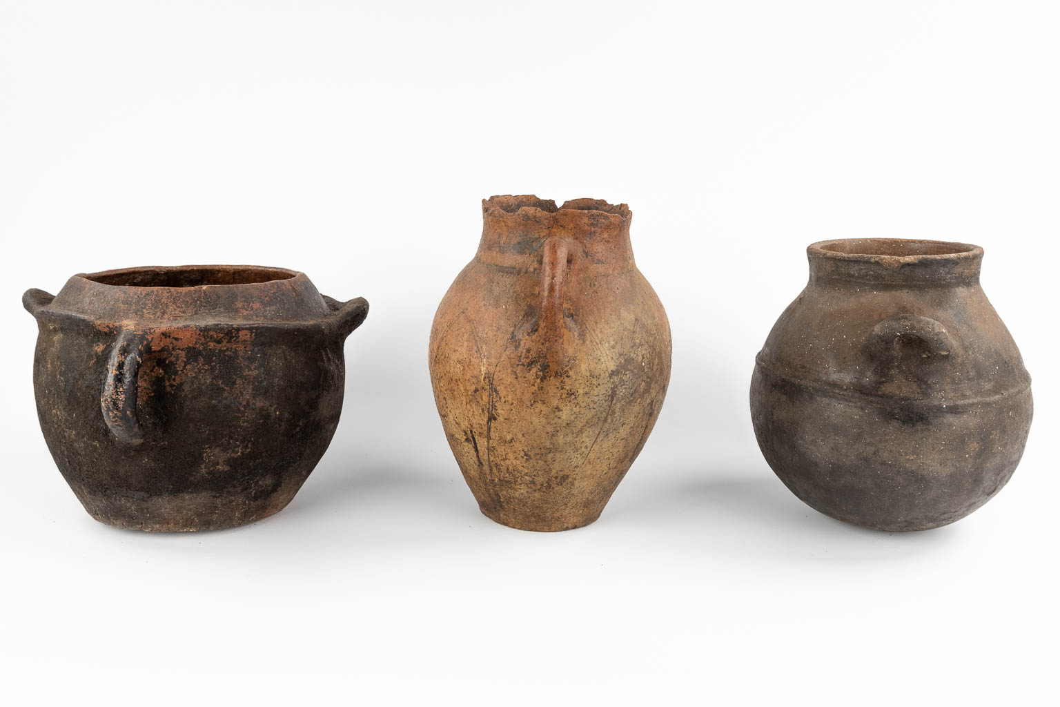 Three antique jugs. (D:22 x W:24 x H:27 cm)