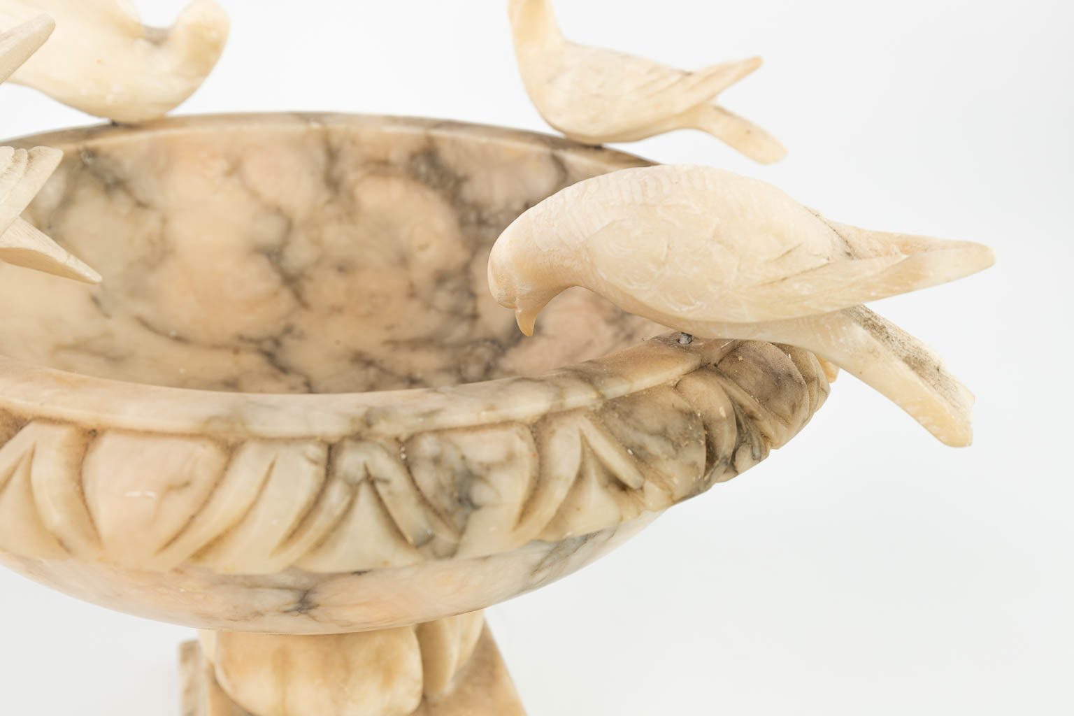 A drinking bowl made of alabaster with figurines of birds. (H:29cm)