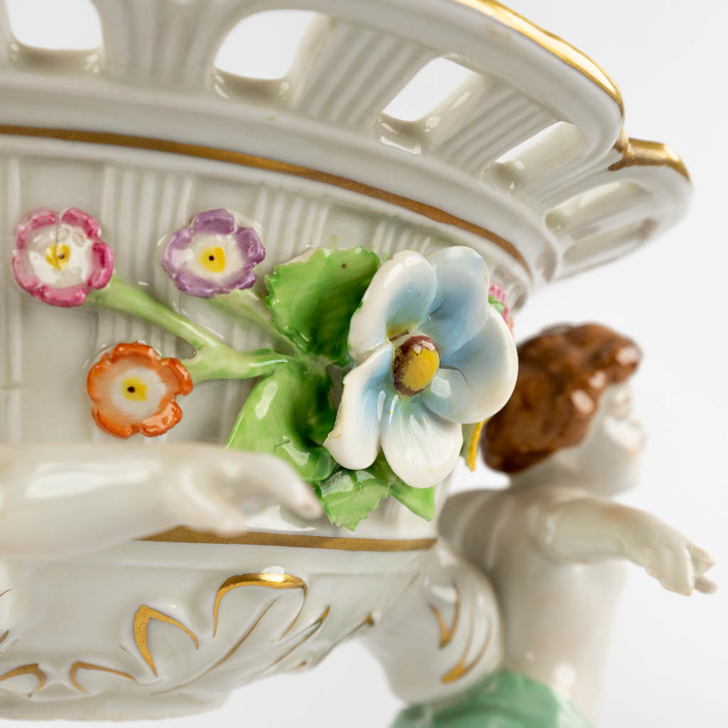 PMP Porcelain, a pair of baskets carried by children. Polychrome porcelain, 20th C. (H:16 x D:23,5 cm)