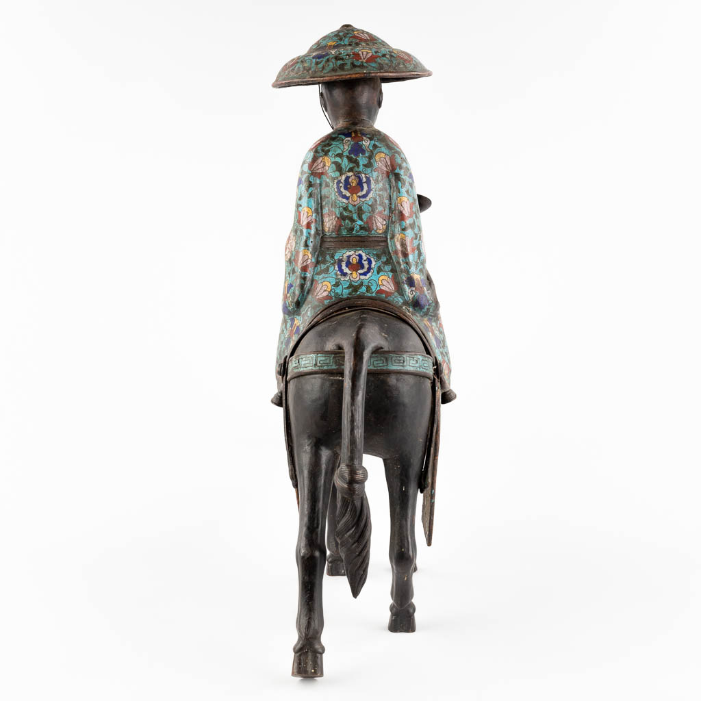 A Japanese figure of Lao Zi seated on a mule, Champslevé bronze. Possibly Meji period. (D:18 x W:55 x H:57 cm)